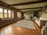 Troya rug in a living room (illustrative)