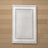 Alleben rug laid flat on a wooden floor