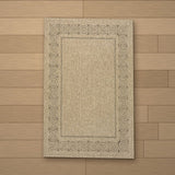 Assos rug laid flat on a wooden floor