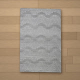 Bodrum rug laid flat on a wooden floor