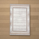 Cesme rug laid flat on a wooden floor
