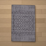 Foca rug laid flat on a wooden floor