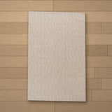 Gobeklitepe rug laid flat on a wooden floor