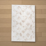 Kommagene rug laid flat on a wooden floor
