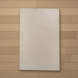 Perre rug laid flat on a wooden floor