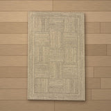 Troya rug laid flat on a wooden floor